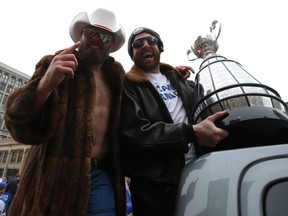 Winnipeg Blue Bombers quarterbacks Chris Streveler (left) and Matt Nichols celebrate with the Grey Cup during a parade on Tues., Nov. 26, 2019. Kevin King/Winnipeg Sun/Postmedia Network