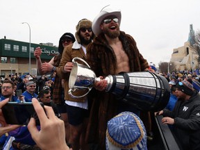 Winnipeg Blue Bombers quarterback Chris Streveler holds the Grey Cup on Pioneer Avenue during the parade on Tues., Nov. 26, 2019. Kevin King/Winnipeg Sun/Postmedia Network
