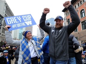 Winnipeg Blue Bombers head coach Mike O'Shea (right) celebrates during the Grey Cup parade on Tues., Nov. 26, 2019. Kevin King/Winnipeg Sun/Postmedia Network