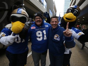 Dancing Gabe Langlois (centre left) and Mayor Brian Bowman (centre right) are photobombed by mascots Buzz (left) and Boomer at the start of the Winnipeg Blue Bombers Grey Cup parade on Tues., Nov. 26, 2019. Kevin King/Winnipeg Sun/Postmedia Network