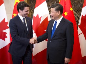 Prime Minister Justin Trudeau meets Chinese President Xi Jinping at the Diaoyutai State Guesthouse in Beijing, China on Tuesday, Dec. 5, 2017. THE CANADIAN PRESS/Sean Kilpatrick ORG XMIT: SKP110 ORG XMIT: POS1712050329314947