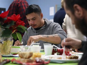 Edward Fleury digs in during the annual Christmas Eve meal at Siloam Mission in Winnipeg on Tues., Dec. 24, 2019. Kevin King/Winnipeg Sun/Postmedia Network