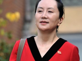 Huawei Chief Financial Officer, Meng Wanzhou, leaves her Vancouver home to appear in British Columbia Supreme Court, in Vancouver, on Oct. 1, 2019. (AFP/Getty Images)