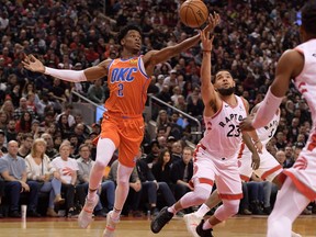 Oklahoma City Thunder guard Shai Gilgeous-Alexander, left, and Toronto Raptors guard Fred VanVleet battle for a loose ball in the first half at Scotiabank Arena, Dec. 29, 2019. (Dan Hamilton-USA TODAY Sports)