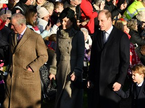 Britain's Prince Charles, Prince of Wales, Britain's Catherine, Duchess of Cambridge, Britain's Princess Charlotte of Cambridge (unseen), Britain's Prince William, Duke of Cambridge, and Britain's Prince George of Cambridge arrive for the Royal Family's traditional Christmas Day service at St Mary Magdalene Church in Sandri ngham, Norfolk, eastern England, on December 25, 2019.
