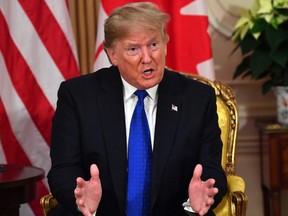 U.S. President Donald Trump speaks with Prime Minister Justin Trudeau during a meeting at Winfield House, London on December 3, 2019. (Photo by NICHOLAS KAMM/AFP via Getty Images)