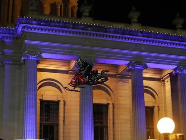 Daniel Shaffer performs during the aerial acrobatic snowmobile performance featuring X Games athletes during the Illuminate 150 event on the grounds of the Manitoba Legislative Building in Winnipeg, Man., on Saturday, Dec. 14, 2019. The Manitoba 150 host committee kicked off the 150-day countdown to Manitoba Day 2020 by flicking the switch to turn on 300,000 LED Christmas lights on the Manitoba Legislative Building and grounds.