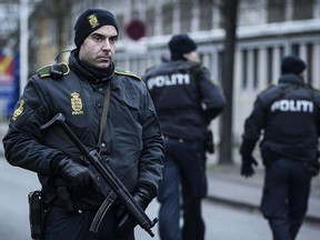 A police officer guards the street around the Noerrebro train station in Copenhagen on February 15, 2015. (CLAUS BJORN LARSEN/AFP/Getty Images)