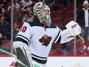 Wild goaltender Devan Dubnyk celebrates after his team’s 8-5 win over the Arizona Coyotes on Thursday. Dubnyk, who has been dealing with a medical situation involving his wife, made his first start since Nov. 16. (CHRISTIAN PETERSEN/Getty Images)