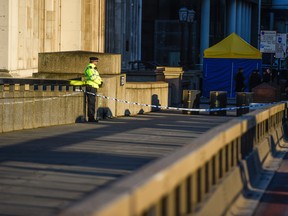 A police officer stands next to where Usman Khan was shot, on London Bridge, on Dec. 2, 2019 in London. (Peter Summers/Getty Images)
