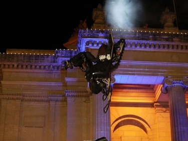 Justin Hoyer performs during the aerial acrobatic snowmobile performance featuring X Games athletes during the Illuminate 150 event on the grounds of the Manitoba Legislative Building in Winnipeg, Man., on Saturday, Dec. 14, 2019. The Manitoba 150 host committee kicked off the 150-day countdown to Manitoba Day 2020 by flicking the switch to turn on 300,000 LED Christmas lights on the Manitoba Legislative Building and grounds.