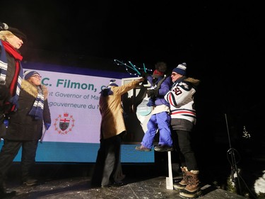 Manitoba 150 co-chair Stuart Murray (right) helps Children's Hospital Champion Child Gianna Eusebio (middle) and 102-year-old Second World War veteran Ralph Wild (left) flick the switch for 300,000 LED Christmas lights to illuminate the Manitoba Legislative Building and the grounds during the Illuminate 150 in Winnipeg, Man., on Saturday, Dec. 14, 2019. The Manitoba 150 host committee kicked off the 150-day countdown to Manitoba Day 2020. Looking on are Lt.-Gov. of Manitoba Janice Filmon and Manitoba 150 co-chair Monique LaCoste.