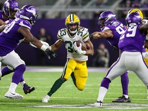 Green Bay Packers running back Aaron Jones carries the ball for a touchdown during the fourth quarter against the Minnesota Vikings at U.S. Bank Stadium in Dec 23, 2019; Minneapolis, Minn., on Dec. 23, 2019.