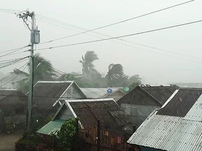 This handout image taken and received on December 2, 2019 courtesy of Gladys Vidal shows heavy rains and moderate wind from Typhoon Kammuri battering houses in Gamay town. (HANDOUT/Courtesy of Gladys Vidal/AFP via Getty Images)