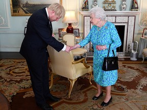 Queen Elizabeth II welcomes Boris Johnson during an audience in Buckingham Palace, where she officially recognised him as the new Prime Minister, in London, Britain July 24, 2019.