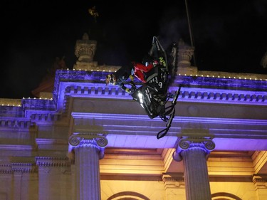 Ryan Adrian performs during the aerial acrobatic snowmobile performance featuring X Games athletes during the Illuminate 150 event on the grounds of the Manitoba Legislative Building in Winnipeg, Man., on Saturday, Dec. 14, 2019. The Manitoba 150 host committee kicked off the 150-day countdown to Manitoba Day 2020 by flicking the switch to turn on 300,000 LED Christmas lights on the Manitoba Legislative Building and grounds.