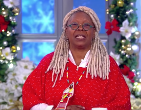 The View host Whoopi Goldberg wears a red jingle dress medallion created by Mish Daniels to spotlight missing and murdered Indigenous women.