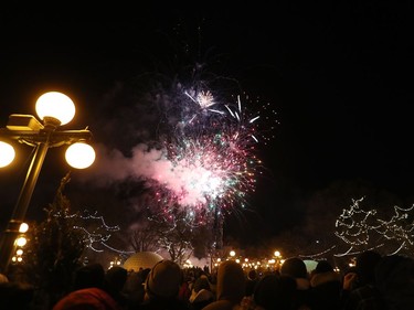 Thousands of Manitobans watch fireworks light up the night sky as 300,000 LED Christmas lights are turned on to illuminate the Manitoba Legislative Building and the grounds during the Illuminate 150 event in Winnipeg, Man., on Saturday, Dec. 14, 2019. The Manitoba 150 host committee kicked off the 150-day countdown to Manitoba Day 2020.