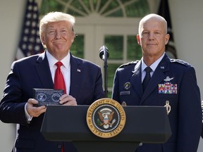 U.S. President Donald Trump stands with General John Raymond, incoming U.S. Space Command commander, during an event to officially launch the United States Space Command in the Rose Garden of the White House in Washington, U.S., August 29, 2019. REUTERS/Kevin Lamarque     TPX IMAGES OF THE DAY ORG XMIT: WAS403