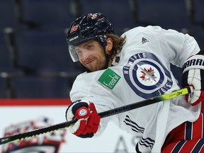 Blake Wheeler follows through on a slap shot during Winnipeg Jets practice on Monday, Dec. 2, 2019.