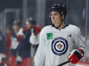 Jack Roslovic watches during Winnipeg Jets practice on Monday.