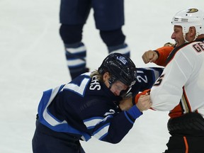 Winnipeg Jets forward Nikolaj Ehlers (left) drops his gloves with Anaheim Ducks centre Ryan Getzlaf in Winnipeg on Sun., Dec. 8, 2019. Kevin King/Winnipeg Sun/Postmedia Network