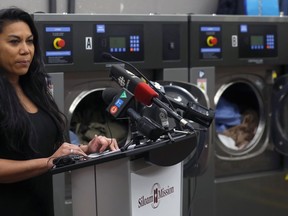 Laiza Pacheco, program director at Siloam Mission, speaks during the official launch of its social enterprise laundry facility on Logan Avenue in Winnipeg on Wed., Dec. 11, 2019. Kevin King/Winnipeg Sun/Postmedia Network