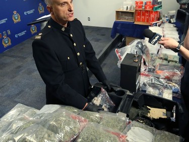 Insp. Max Waddell of the Winnipeg Police Service organized crime unit displays items seized through Project Highland at WPS headquarters on Mon., Dec. 23, 2019. Kevin King/Winnipeg Sun/Postmedia Network