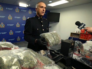 Insp. Max Waddell of the Winnipeg Police Service organized crime unit displays items seized through Project Highland at WPS headquarters on Mon., Dec. 23, 2019. Kevin King/Winnipeg Sun/Postmedia Network