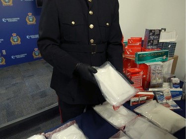 Insp. Max Waddell of the Winnipeg Police Service organized crime unit displays items seized through Project Highland at WPS headquarters on Mon., Dec. 23, 2019. Kevin King/Winnipeg Sun/Postmedia Network