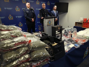 Insp. Max Waddell (centre) of the Winnipeg Police Service organized crime unit, along with Det. Insp. Jim Walker (left) the deputy director of the Ontario Provincial Police central organized crime enforcement bureau, and Ron Bell, supervisor of the special investigations unit for Manitoba Finance and Taxation, speak to media about Project Highland at WPS headquarters on Mon., Dec. 23, 2019. Kevin King/Winnipeg Sun/Postmedia Network