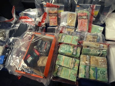 Cash, drugs, phones and ammunition were among items seized during Project Highland which were on display at Winnipeg Police Service headquarters on Mon., Dec. 23, 2019. Kevin King/Winnipeg Sun/Postmedia Network