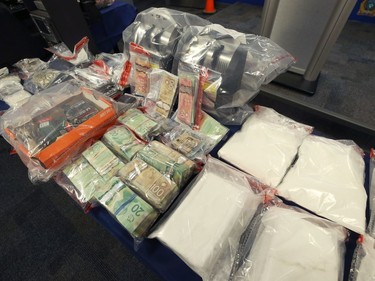 Cash, drugs, phones and ammunition were among items seized during Project Highland which were on display at Winnipeg Police Service headquarters on Mon., Dec. 23, 2019. Kevin King/Winnipeg Sun/Postmedia Network