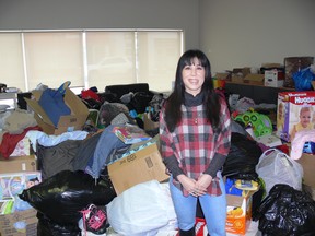 NDP MP Leah Gazan (Winnipeg Centre) stands in front of an every-growing collection of clothing, toys and household items at her riding office on Sargent Avenue in Winnipeg on Sunday, Dec. 29, 2019. Over Christmas and Boxing Day, 31 community members of Winnipeg's West End were displaced due to two separate fires on Agnes and Furby streets. On Dec. 27 and 28, MP Leah Gazan and NDP MLA Lisa Naylor (Wolseley) met with families and individuals impacted by the fires. A drop-off location is being held over the weekend at 892 Sargent Avenue on Saturday, Dec. 28 and Sunday, Dec. 29 between 11 a.m.-2 p.m. and Monday, Dec. 30 between 10 a.m.-4 p.m. GLEN DAWKINS/Winnipeg Sun/Postmedia Network