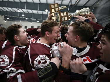 The St. Paul's Crusaders celebrate victory over the Sturgeon Heights Huskies in the provincial high school hockey final at Bell MTS Iceplex in Winnipeg on Mon., March 11, 2019. Kevin King/Winnipeg Sun/Postmedia Network ORG XMIT: POS1903112120240474