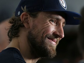 Blake Wheeler smiles while answering questions from reporters during Winnipeg Jets training camp at Bell MTS Iceplex on Tues., Sept. 17, 2019. Kevin King/Winnipeg Sun/Postmedia Network ORG XMIT: POS1909171428101696