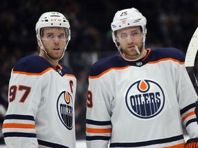 Connor McDavid and Leon Draisaitl of the Edmonton Oilers prepare to skate against the New York Islanders at NYCB's LIVE Nassau Coliseum on October 08, 2019 in Uniondale, New York.