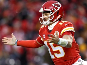 Patrick Mahomes of the Kansas City Chiefs celebrates an eight yard touchdown pass against the Houston Texans during the fourth quarter in the AFC Divisional playoff game at Arrowhead Stadium on January 12, 2020 in Kansas City, Missouri.
