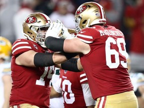 Joe Staley and Mike McGlinchey of the San Francisco 49ers react to a touchdown against the San Francisco 49ers during the second half of the NFC Championship game at Levi's Stadium on January 19, 2020 in Santa Clara, California.