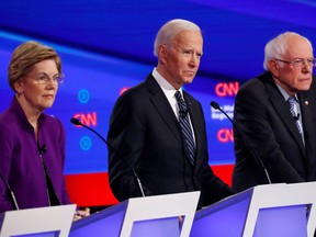 Democratic 2020 U.S. presidential candidates, left to right, Senator Elizabeth Warren (D-MA), former vice-president Joe Biden and Senator Bernie Sanders (I-VT) participate in the seventh Democratic 2020 presidential debate at Drake University in Des Moines, Iowa, Jan. 14, 2020. (REUTERS/Shannon Stapleton/File Photo)