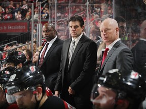 Mike Grier (left) is an assistant coach with the New Jersey Devils. (GETTY IMAGES)