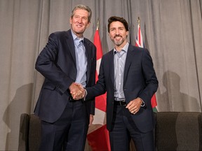 Manitoba Premier, Brian Pallister shakes hands with Prime Minister Justin Trudeau before speaking to media during day 2 of the Liberal cabinet retreat at the Fairmont Hotel in Winnipeg, Monday.
