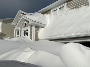 Pile of snow is pictured outside a house in St John's, Newfoundland And Labrador, Canada January 18, 2020 in this picture obtained from social media. Picture taken January 18, 2020.