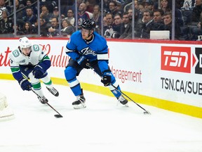 Jets forward Andrew Copp (right) says the time for excuses is over and “it’s up to us” to make some gains as the team pushes for a playoff position down the stretch. (USA TODAY SPORTS)