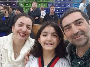 Mahdi Sadeghi, his wife, Bahareh Hajesfandiari, and their daughter, Anisa Sadeghi.