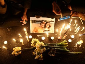 People and families of the victims of the crash of the Boeing 737-800 plane, flight PS 752, light candles as they gather to show their sympathy in Tehran, Iran January 11, 2020.