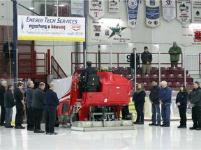Coworkers form an honour guard as the zamboni (Engo Ice Resurfacer) bearing the cremation urn of Al Wilcox exits Thistle Arena in Kenora, Ont., on Saturday, Jan.18, 2020. Reg Clayton/Miner and News