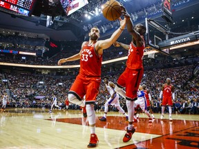 Raptors’ Marc Gasol (left) and Chris Boucher keep the ball inbounds during a late-November game against the 76ers. Gasol is set to retun to the lineup on Wednesday. (Ernest Doroszuk/Toronto Sun Files)