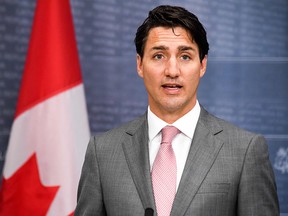 In this file photo taken on July 10, 2018, Prime Minister Justin Trudeau addresses a joint press conference with his Latvian counterpart following their meeting in Riga, Latvia.