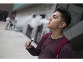 WINDSOR, ONT:. SEPTEMBER 12 - Ahmad El-Mosri, 21, takes a hit from his vape outside St. Clair College where he's in his second year of accounting, Thursday, Sept. 12, 2019.